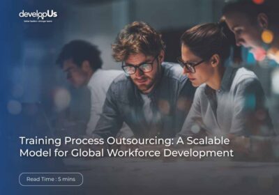 Three professionals collaborate at a desk in a blue-tinted office; article title reads 'Training Process Outsourcing: A Scalable Model for Global Workforce Development'.